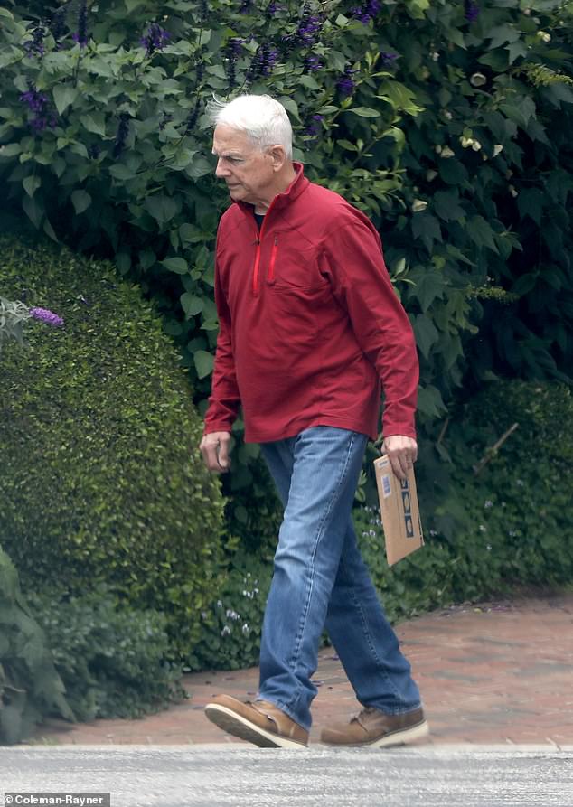 In another set of exclusive photos, Harmon was captured dressed in a bright red sports top while casually picking up mail from the same address.