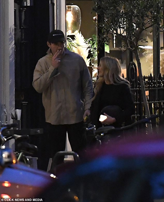 The singer, 37, flashed a beaming smile as she walked alongside the art dealer, 32, as they left the restaurant separately after meeting for dinner.