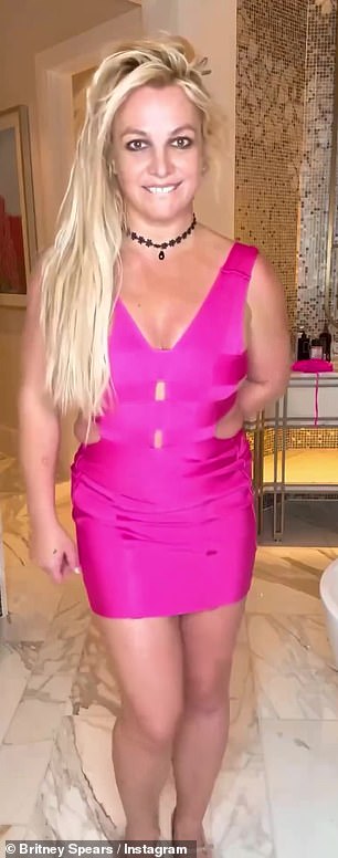 The 42-year-old pop icon wore a hot pink bandage minidress in a video clip.