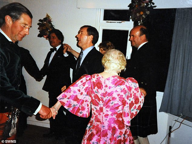 Prince Charles dancing with the Queen Mother during a staff party at Birkhall