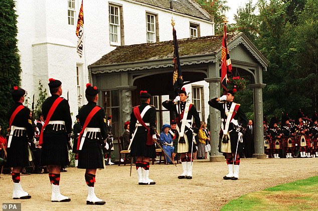 The Queen Mother watching the ceremony presenting the 1st Battalion, The Black Watch, new colours, at Birkhall.