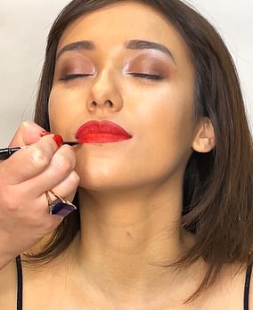 You can line your lips using the sharper side of a flat lip brush, going slightly over the line of your Cupid's bow and lower lip.