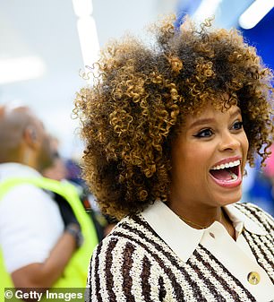 In a solo shot, the Sax singer looked delighted as she watched the entire brand come to life in the store, while her sister smiled.