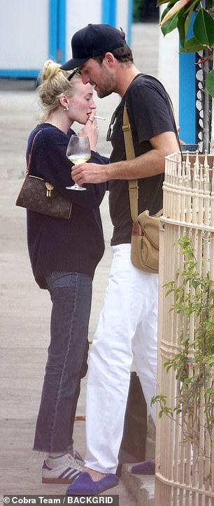 To stay stylish, Sophie opted for a simple navy jumper and straight-fit jeans while resting her sunglasses on her head.