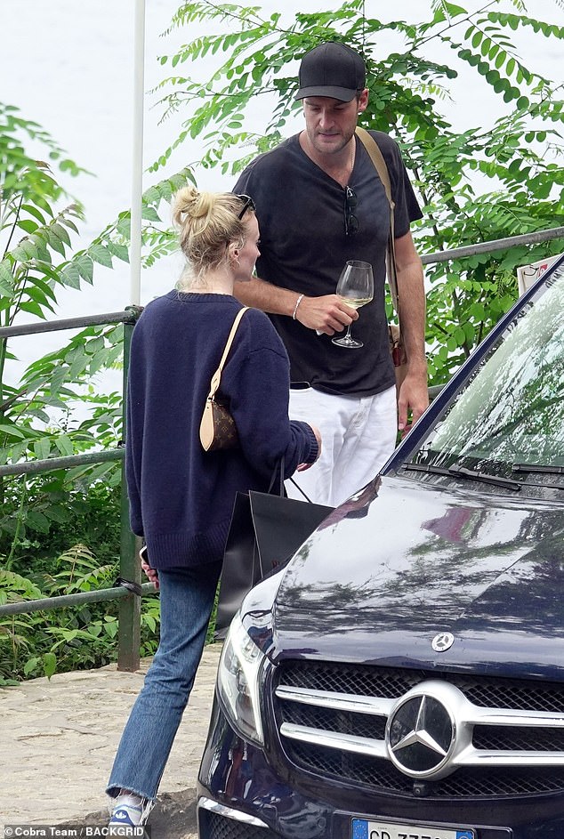 Peregrine looked dapper in a black T-shirt, white pants and black baseball cap.