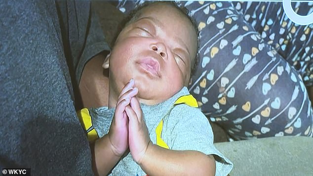 Hughes claimed his son Traveon Jr (pictured) accidentally choked, but prosecutors argued the baby was too young to be able to ball up a washcloth and put it in his mouth.