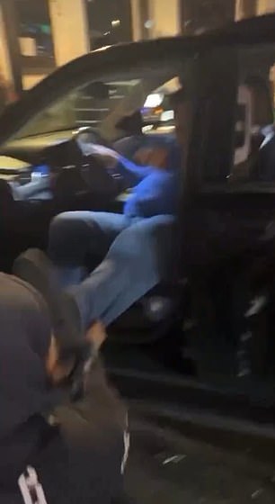 Immediately afterwards, the aggressor grabbed his legs and tried to pull him out of the car so that the entire group could crash him into the ground.