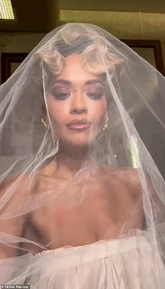 The Hot Right Now singer revealed she wore three different Tom Ford looks for her big day (pictured in a wedding dress for her You Only Love Me music video).