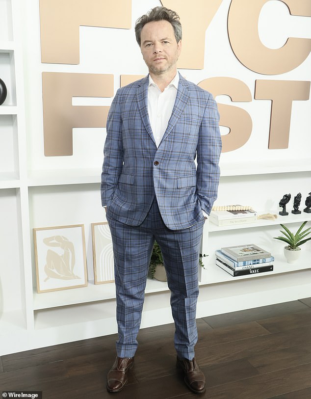 Noah Hawley wore a blue plaid suit, white shirt, and dark brown leather shoes while spending time with the actors.