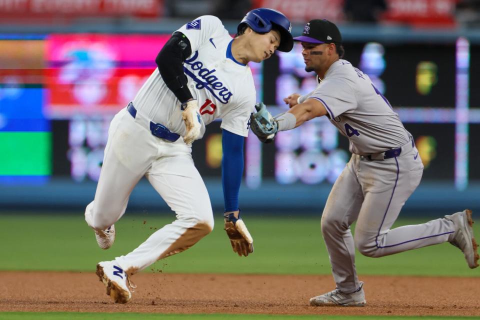 Colorado Rockies shortstop Ezequiel Tovar throws out Dodgers star Shohei Ohtani during the third inning on Saturday.