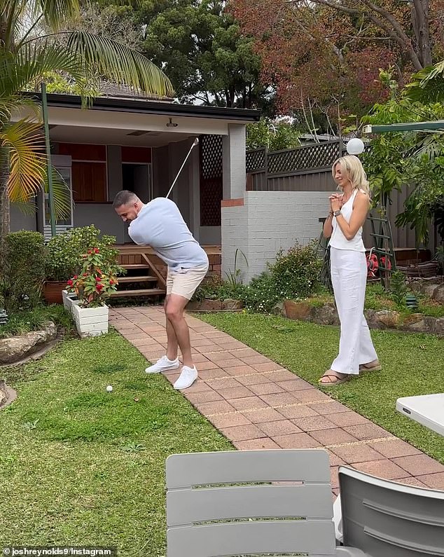 In the clip, Josh is seen hitting a golf ball in what appears to be the couple's backyard, before the ball explodes into a cloud of pink dust.