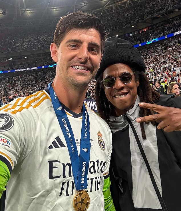 Jay Z (right) was also photographed with Thibaut Courtois (left) on the pitch at full time.