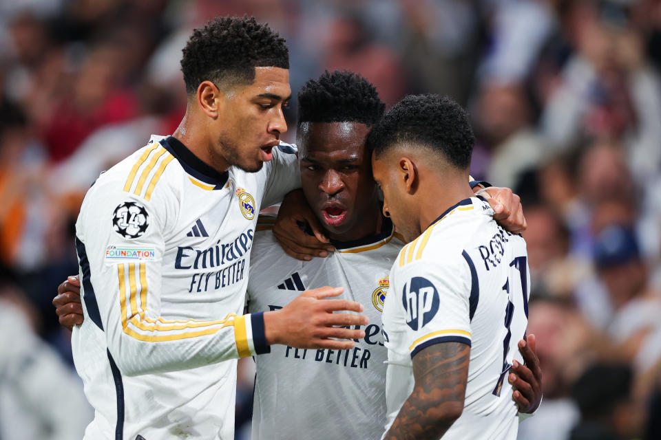 MADRID, SPAIN - APRIL 9: Rodrygo of Real Madrid celebrates with his teammates Jude Bellingham and Vinicius Jr after scoring his team's second goal during the UEFA Champions League quarterfinal first leg match between Real Madrid CF and Manchester City at the Santiago Bernabeu Stadium on April 9. , 2024 in Madrid, Spain. (Photo by James Gill - Danehouse/Getty Images)