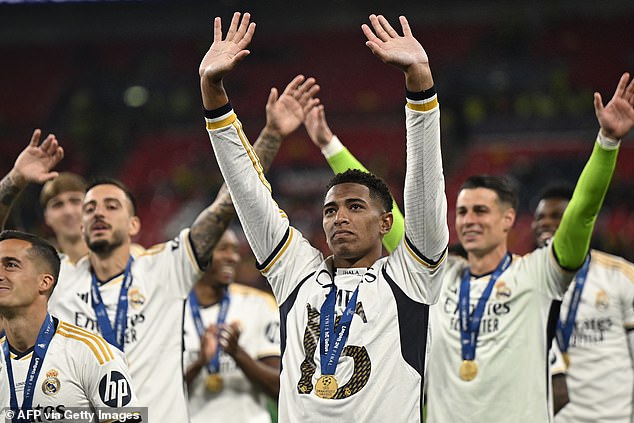 Bellingham (centre) celebrated alongside his team-mates at Wembley at full time.