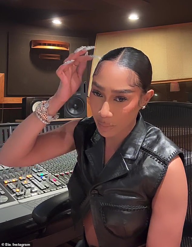 The Medford, Massachusetts native, who donned a leather vest and had her locks parted in the clip, took aim at Cardi B about other topics on the diss track.