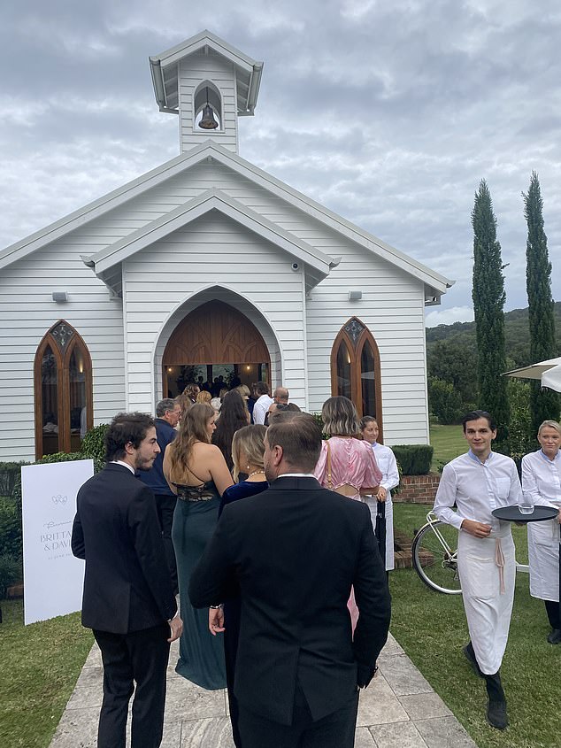 Pictured: Guests entering the chapel on Saturday afternoon, before the ceremony.