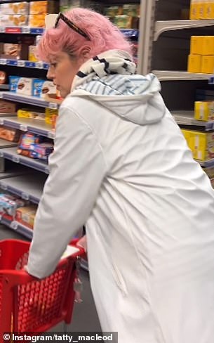 Macleod happily walks down the aisles on his trip to the supermarket