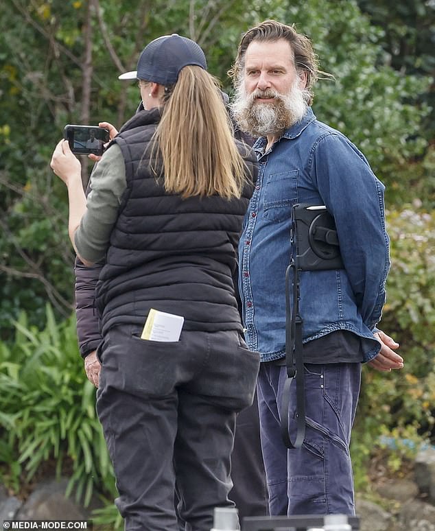 He looked unrecognizable, sporting long locks complemented by a thick gray beard.