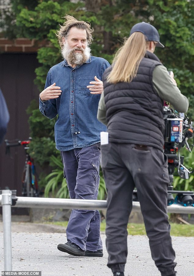 Scott dressed for comfort in a denim shirt and blue pants.