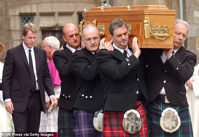 Earl Spencer walks behind his mother's coffin at her funeral at St Columba's Cathedral in Oban, Scotland