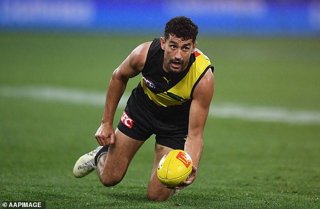 Police allege Pickett (pictured playing against Geelong last Sunday) was involved in a series of robberies in which more than $350,000 was stolen.