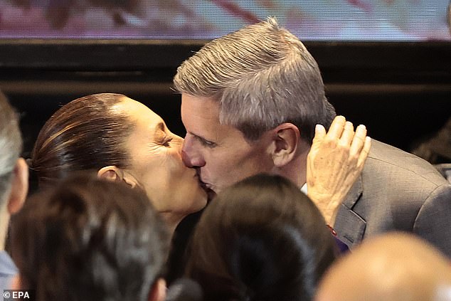 Mexican presidential candidate Claudia Sheinbaum kisses her husband Jesús María Tarriba (pictured, right)