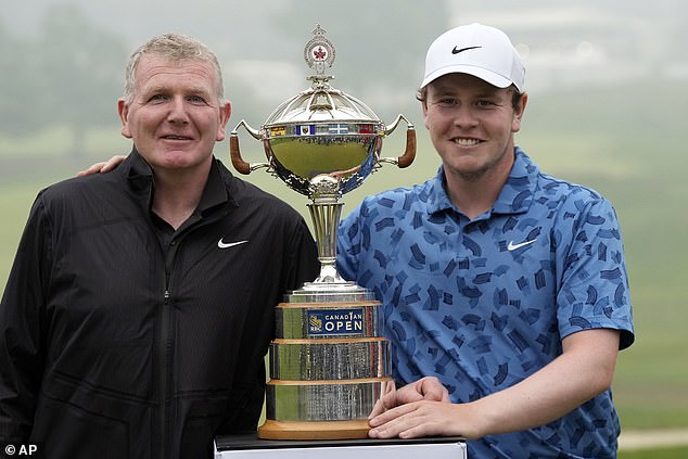 Scotland's Robert MacIntyre (R) and his father, Dougie (L), after winning the Canadian Open