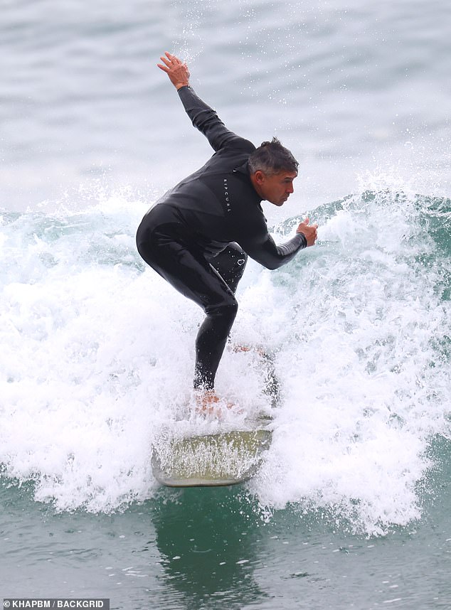 At one point, he seemed to almost lose his balance, but quickly corrected himself before falling into the sea.