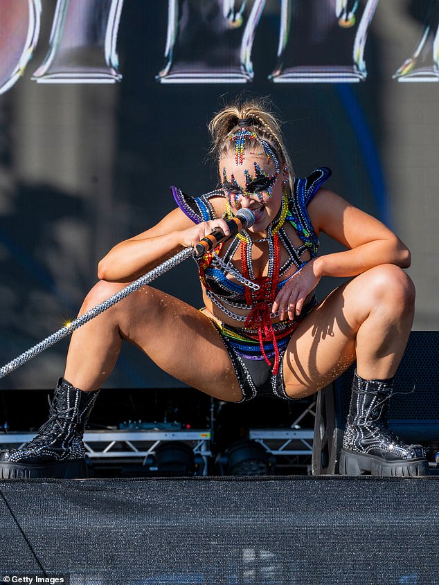 The out-of-this-world ensemble helped show off her legs, as well as her toned tummy, by splitting the ensemble into two separate pieces, which included shoulder wings for the top.