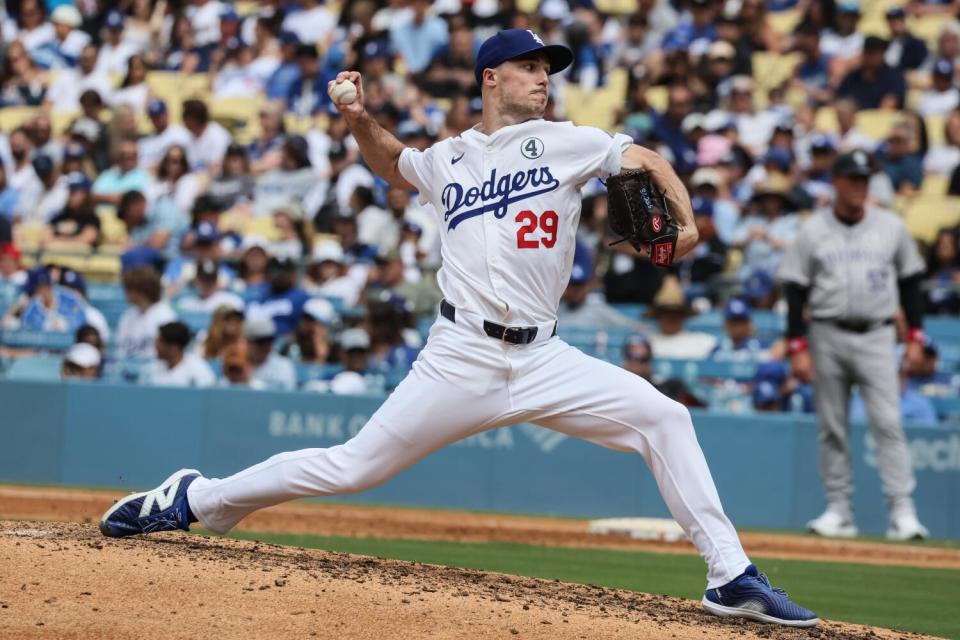 Dodgers pitcher Michael Grove delivers during the seventh inning on Sunday against the Rockies.