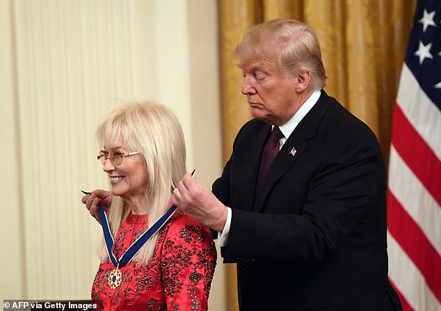 US President Donald Trump presents the Presidential Medal of Freedom to Dr. Miriam Adelson at the White House in 2018