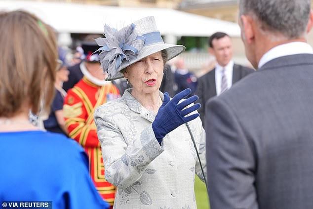 Princess Anne meets guests during the Sovereign's Royal National Lifeboat Institution garden party at Buckingham Palace in May.