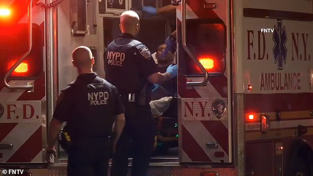 An illegal Venezuelan migrant was arrested for allegedly shooting two NYPD officers while they were riding a scooter after they tried to stop him, authorities said. (In the photo: Castro-Mata is taken on a stretcher from the scene of the shooting)