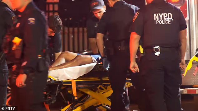 Police approached Bernardo Raul Castro-Mata, 19, as he drove the illegal vehicle the wrong way on a one-way road in East Elmurst in Queens overnight. (In the photo: Castro-Mata is taken on a stretcher from the scene of the shooting)