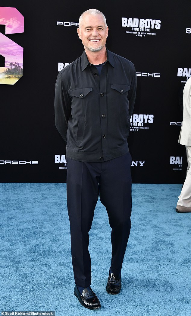 The actor, 51, rocked a black button-down shirt and black dress pants paired with dark loafers and a blue T-shirt as he posed up a storm.