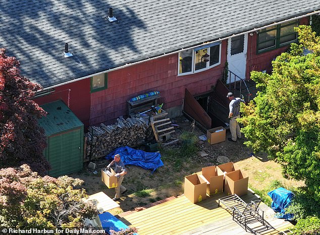 Search teams removing items from the basement of Rex Heuermann's home