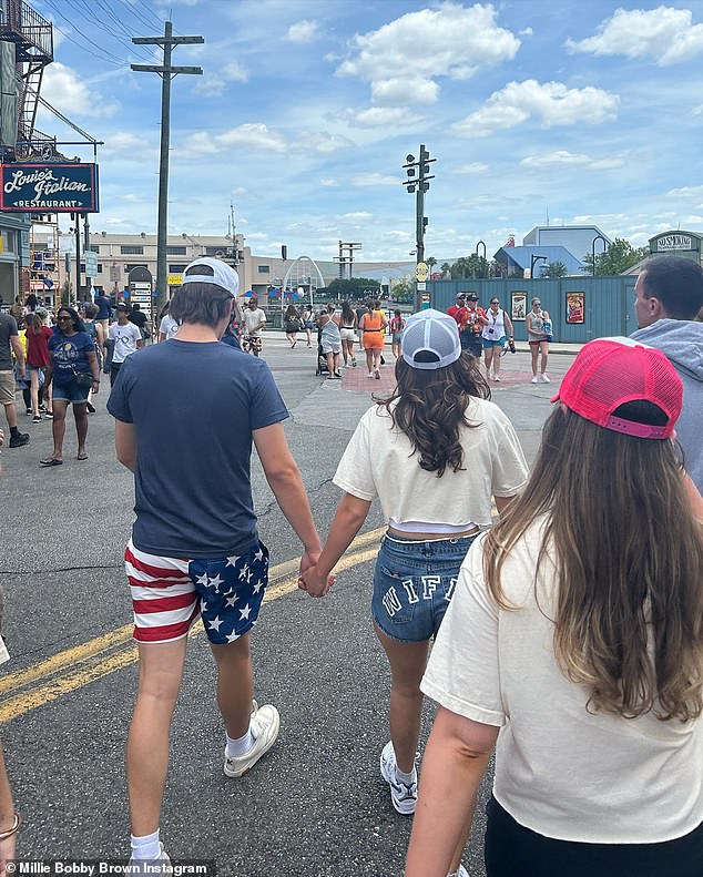 They adorably held hands as they walked through the gardens.