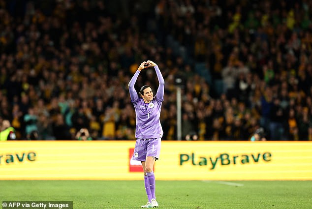 Williams shows a love heart symbol to the thousands of Australian fans who came to watch the match and honor his final game for their country.