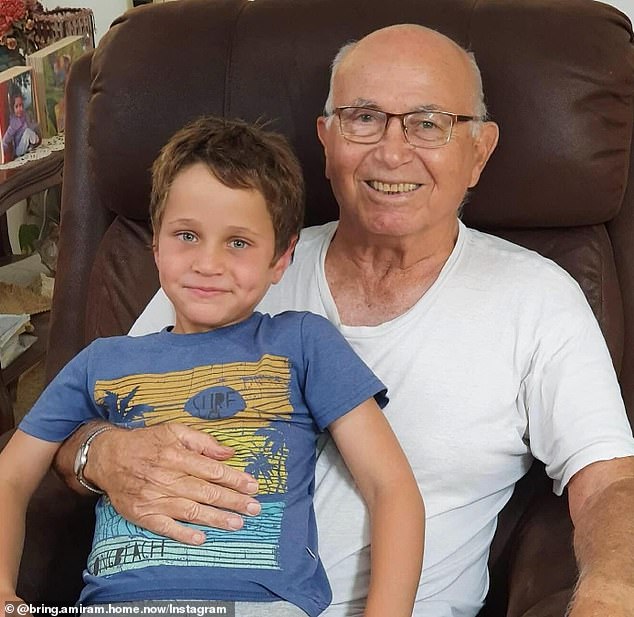 Amiram appears in the photo with his grandson.