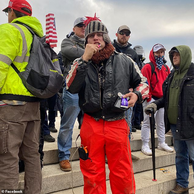 Comrades at Wednesday's demonstration, brushing their teeth. He said he wanted to be part 'of history'