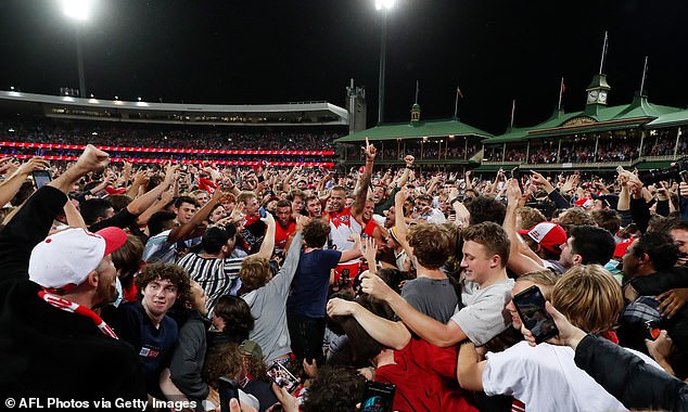 Dozens of security guards were posted around the border fence, but they had no hope of stopping the human tsunami at the SCG (pictured).