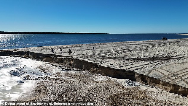 The steep edge left by the landslide was well above the height of an adult and the sand formed a layer over the salt water.