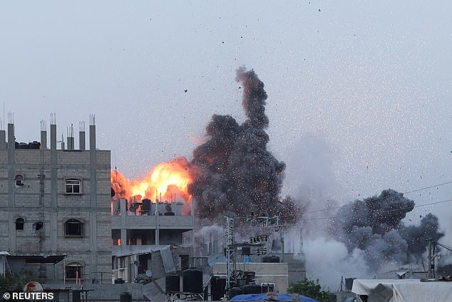 Smoke and flames rise during Israeli airstrike in central Gaza Strip