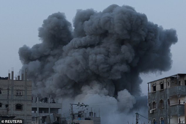 Smoke rises during Israeli airstrike in central Gaza Strip