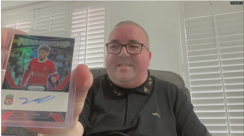 Stephen Bunting holds a card signed by Harvey Elliott