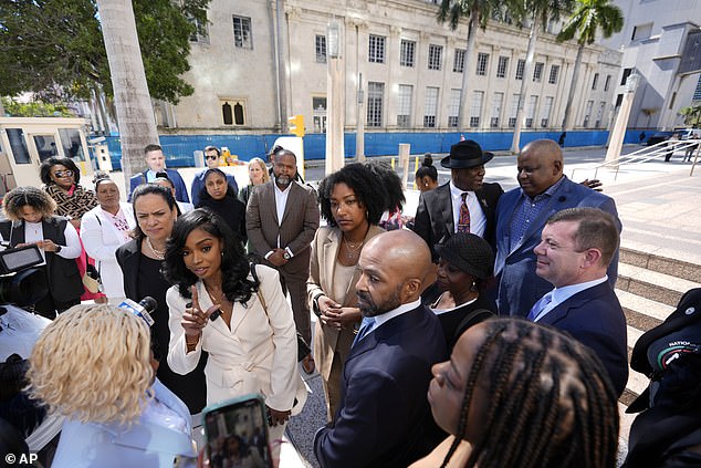 The Fearless Fund co-founders and CEOs Arian Simone, center left, and Ayana Parsons, center right, speak to reporters outside a federal courthouse in Miami.