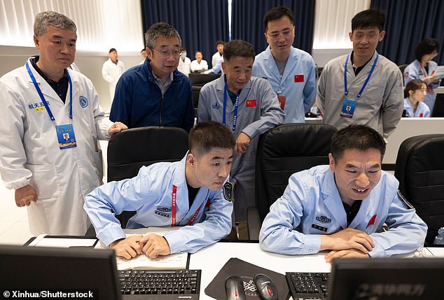 The lander was operated from a control center in Beijing (pictured), but the signal needed to bounce off a relay satellite launched in May in order to reach the far side of the moon.