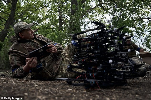 Near the border with Russia, Ukrainian soldiers prepare drones for combat on May 16