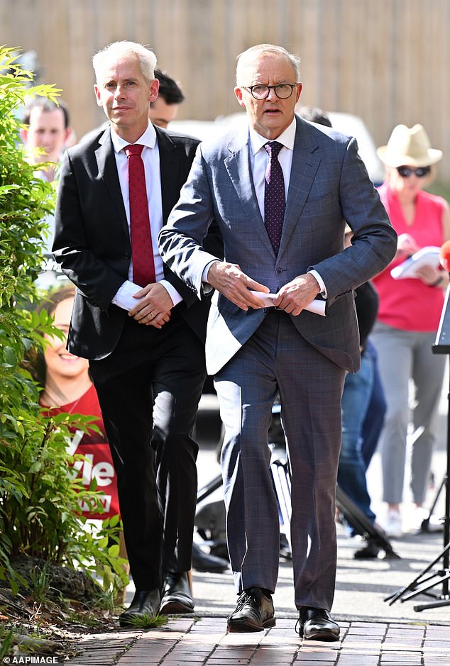 Immigration Minister Andrew Giles has been under pressure to resign since the release late last year of more than 150 detainees, including murderers and sex offenders. Giles (left) is pictured with Prime Minister Anthony Albanese.