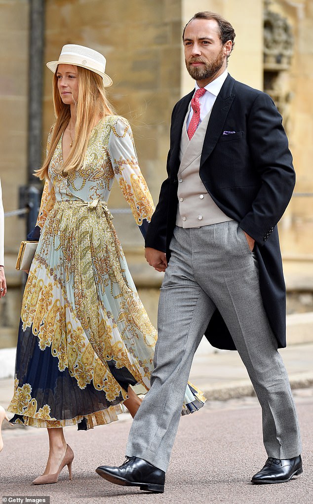 James credits Ella for introducing him to his wife Alizee, as the pair met when the puppy 'made a beeline' for her in 2018. Above: The couple pictured in 2019